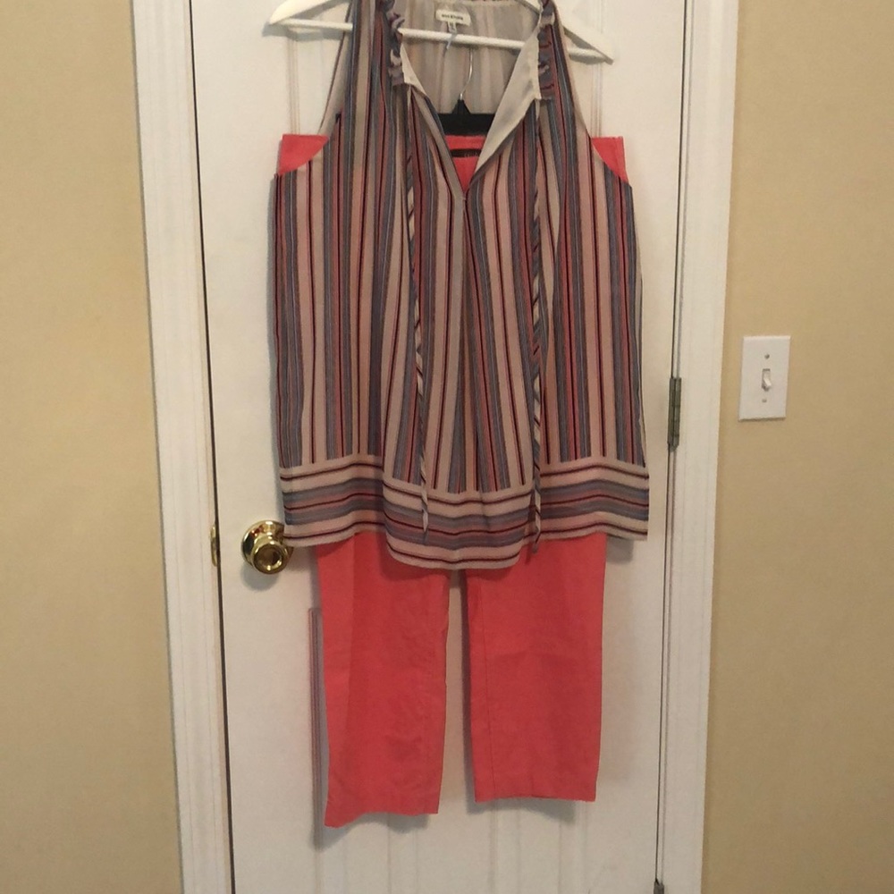 Salmon pink colored pants; worn a couple of times. True to size; stretch fabric